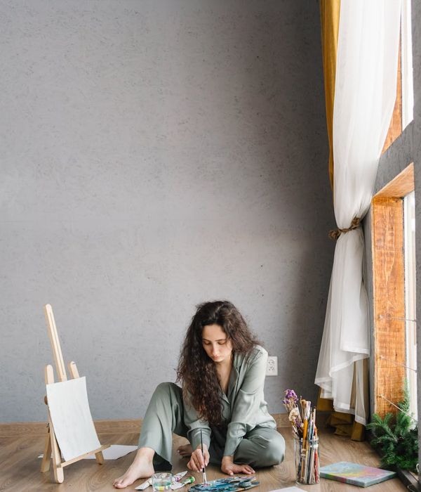 Woman feeling energized and vibrant after a yoga practice, looking upwards.